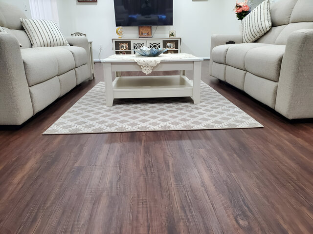 Selection of laminate flooring options including wood grain and tile patterns